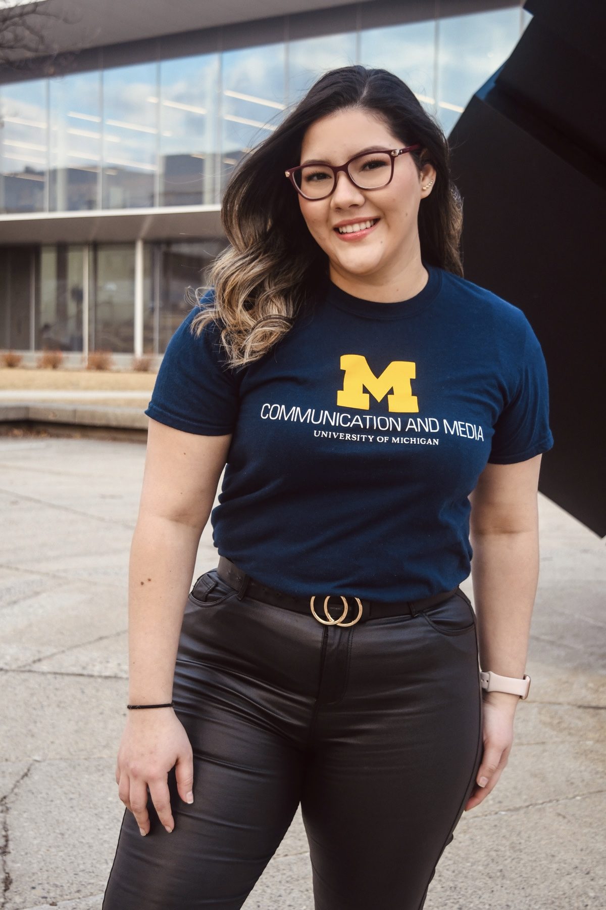 Ruth in a Michigan Communication and Media shirt on campus, photographed for LSA student life content.